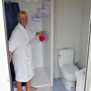 Customer in our mobile ensuite | Kenny's Mobile Event Hire
